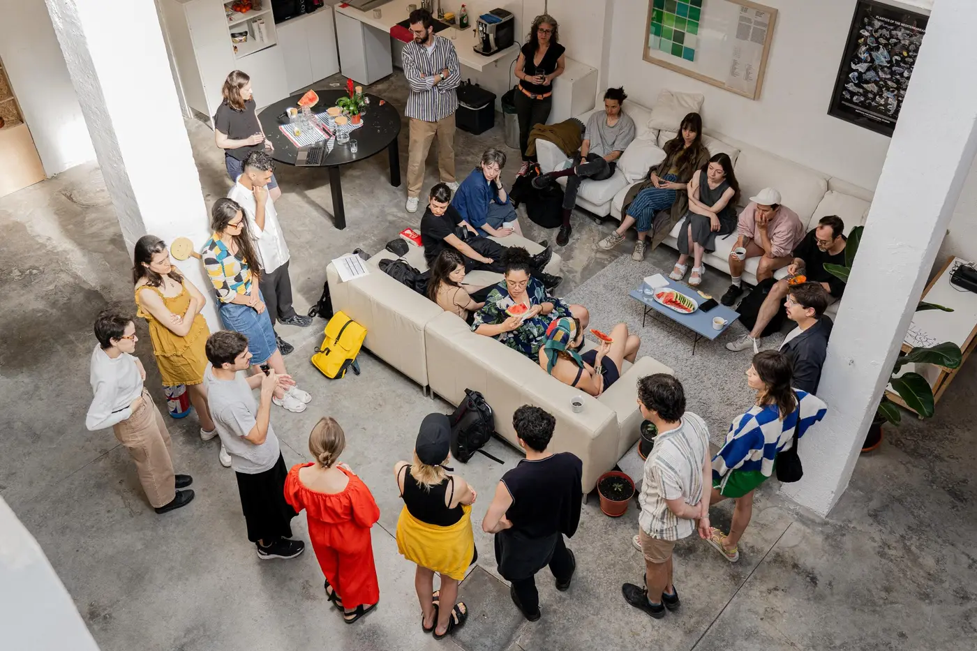 Participants at IPS gathered around a sofa having a discussion